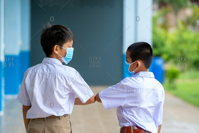 Elementary school students with face mask back at school