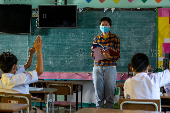 Group of Asian elementary students wearing protective masks