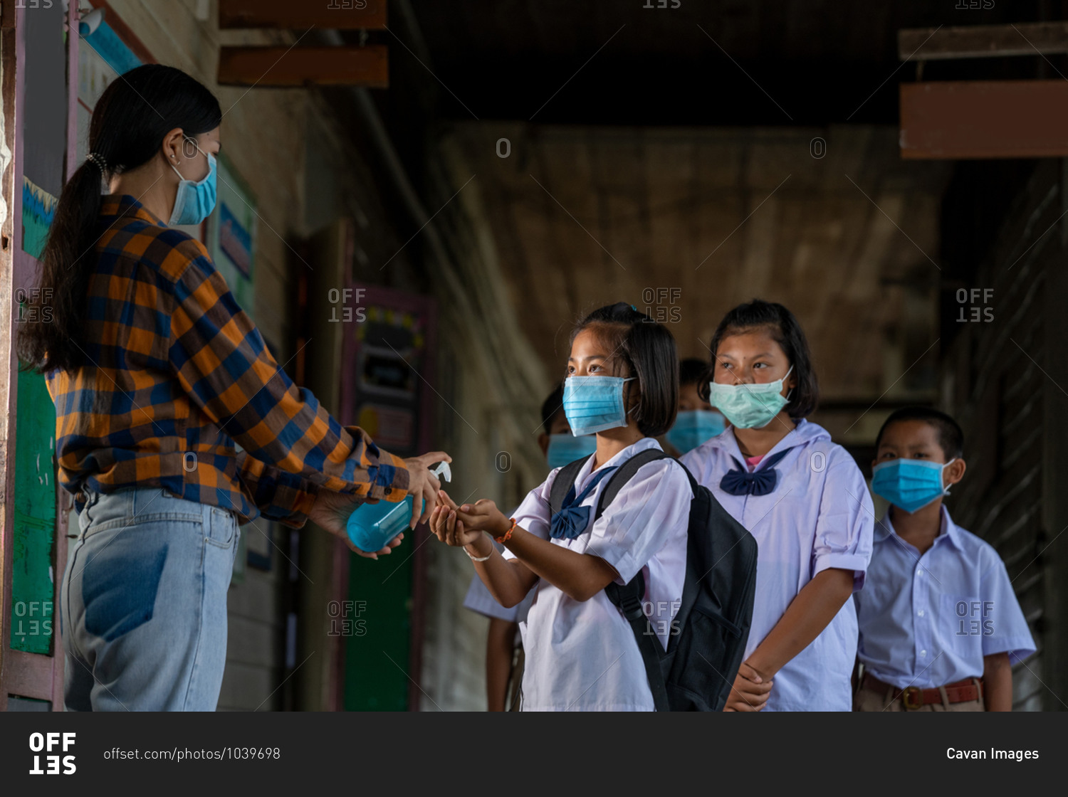 Teacher wearing protective mask to protect against covid-19