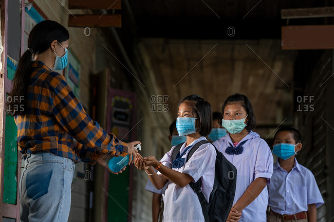 Teacher wearing protective mask to protect against covid-19