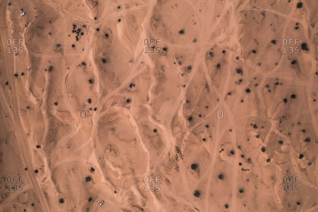 Aerial Top Down View Of Car Tracks On The Dry Sand Dunes Of The Arabian Desert, Dubai, UAE