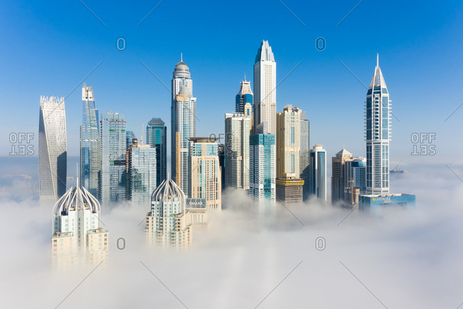 March 14, 2019: Aerial view of misty skyscrapers in Dubai, United Arab Emirates.