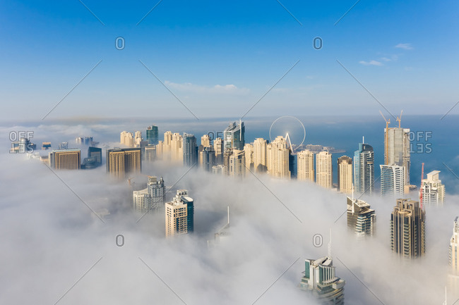 March 14, 2019: Aerial view of misty skyscrapers in Dubai, United Arab Emirates.