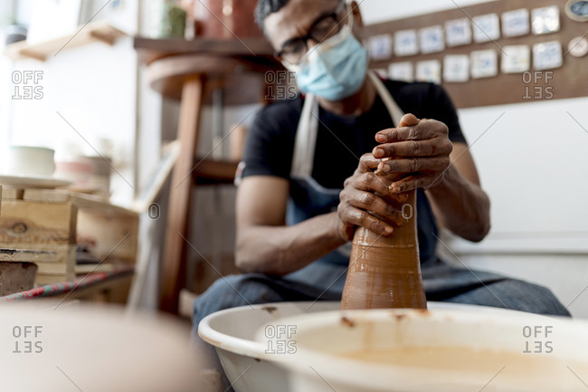 Attentive Senior Man Molding Clay Stock Photo - Image of paint, occupation:  99904544