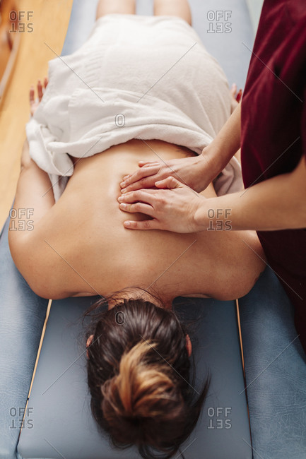 Physiotherapist treating backache with massage