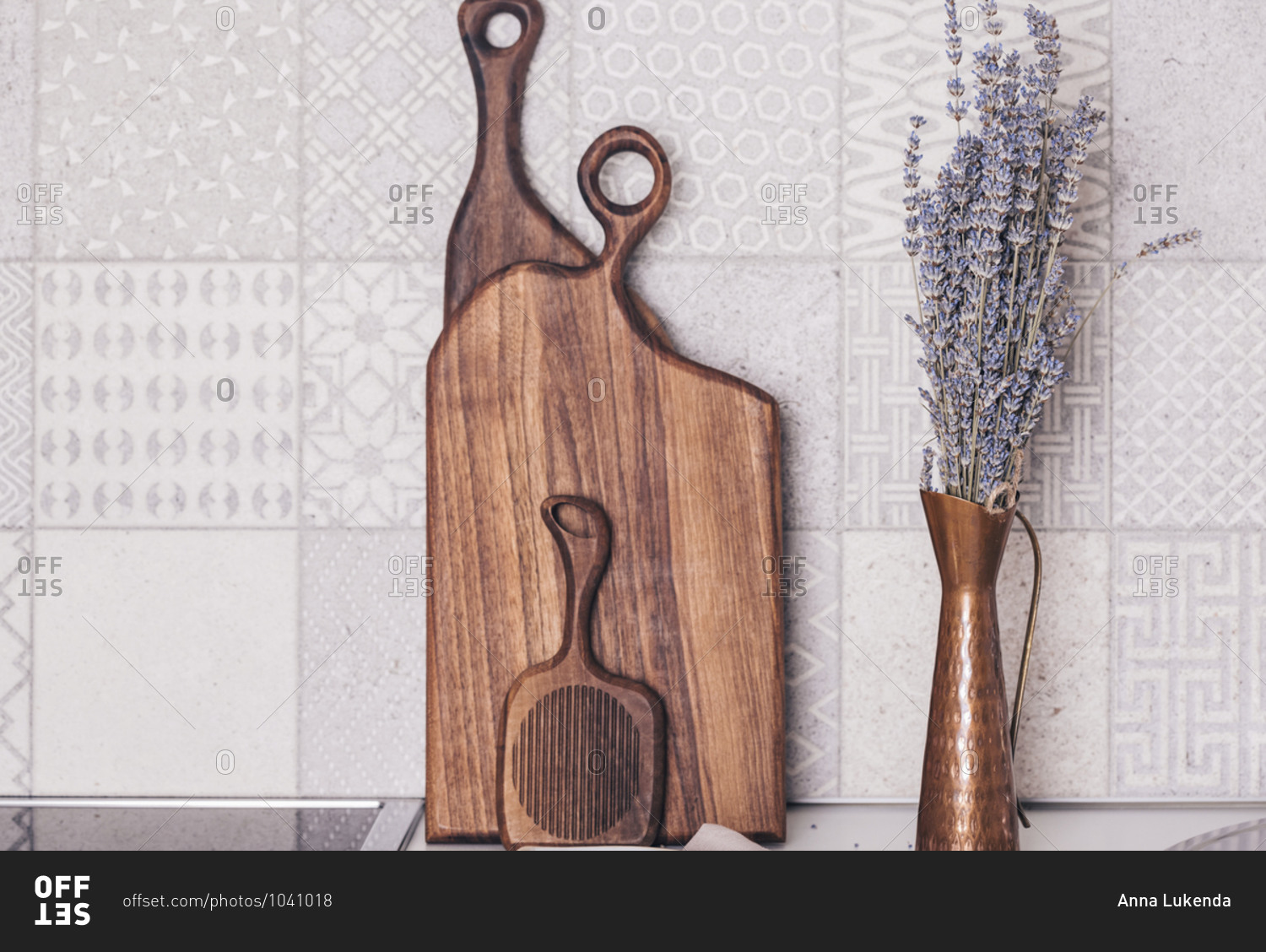 Copper vase with lavender in the kitchen with wooden boards