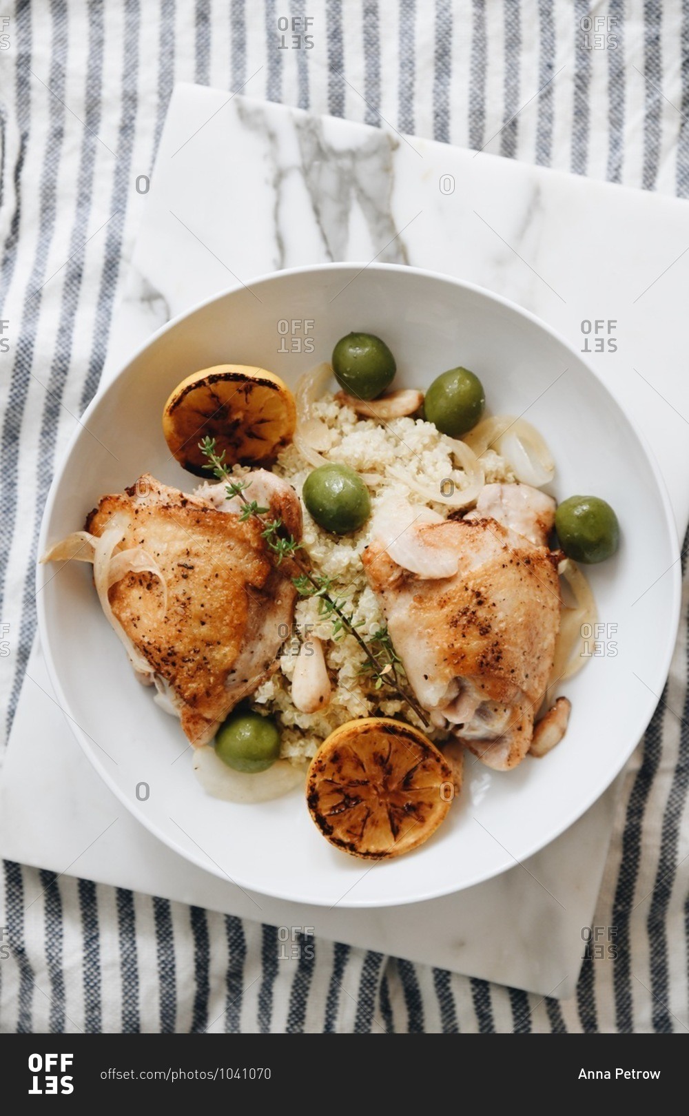 Overhead view of roasted chicken and rice in a bowl