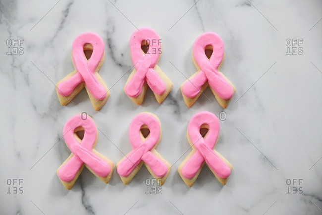 Breast Cancer Awareness sugar cookies on a marble surface