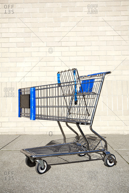Abandoned shopping cart, trolley, metal and plastic