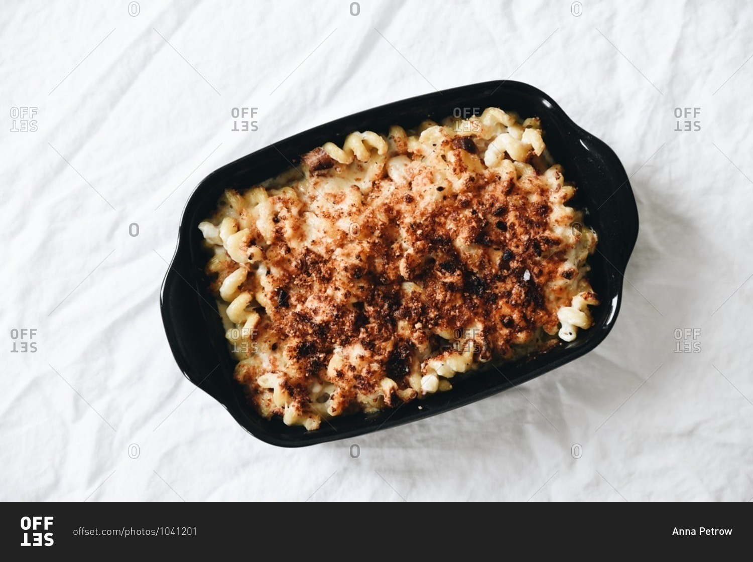 Overhead view of a baked macaroni and cheese dish with spiral noodles