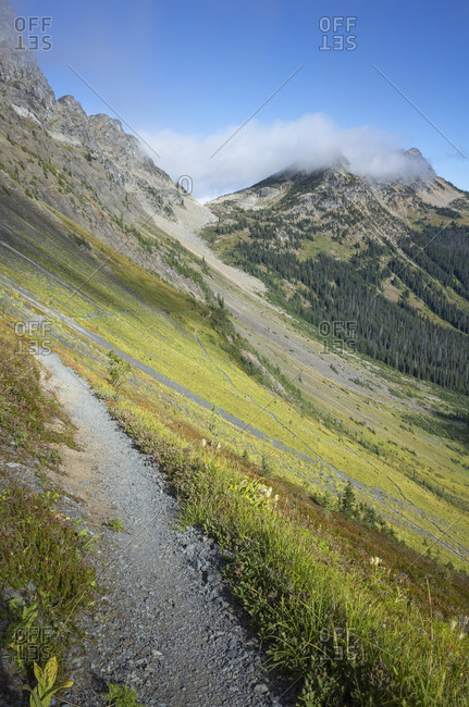 View of the Pacific Crest Trail through vast alpine valley and meadow, autumn