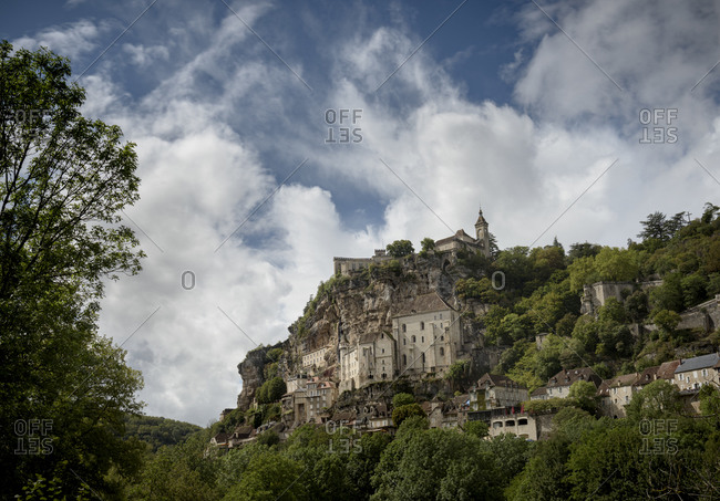 View of old castle, churches and chapels in the holy clifftop town of Rocamadour in the Alzou Canyon in the Lot department within the Occitanie region of southern France