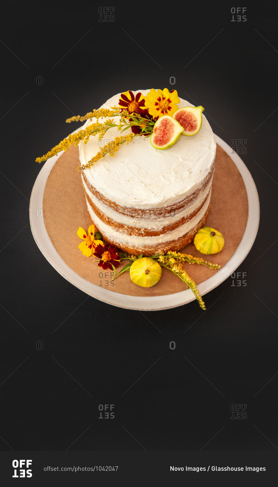 High Angle View of Vanilla Layer Cake Decorated with Edible Fresh Flowers and Fruit