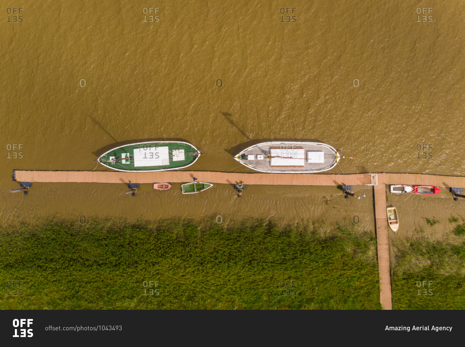 Aerial view of boats moored on the Sado river at Alcacer do Sal, Portugal.
