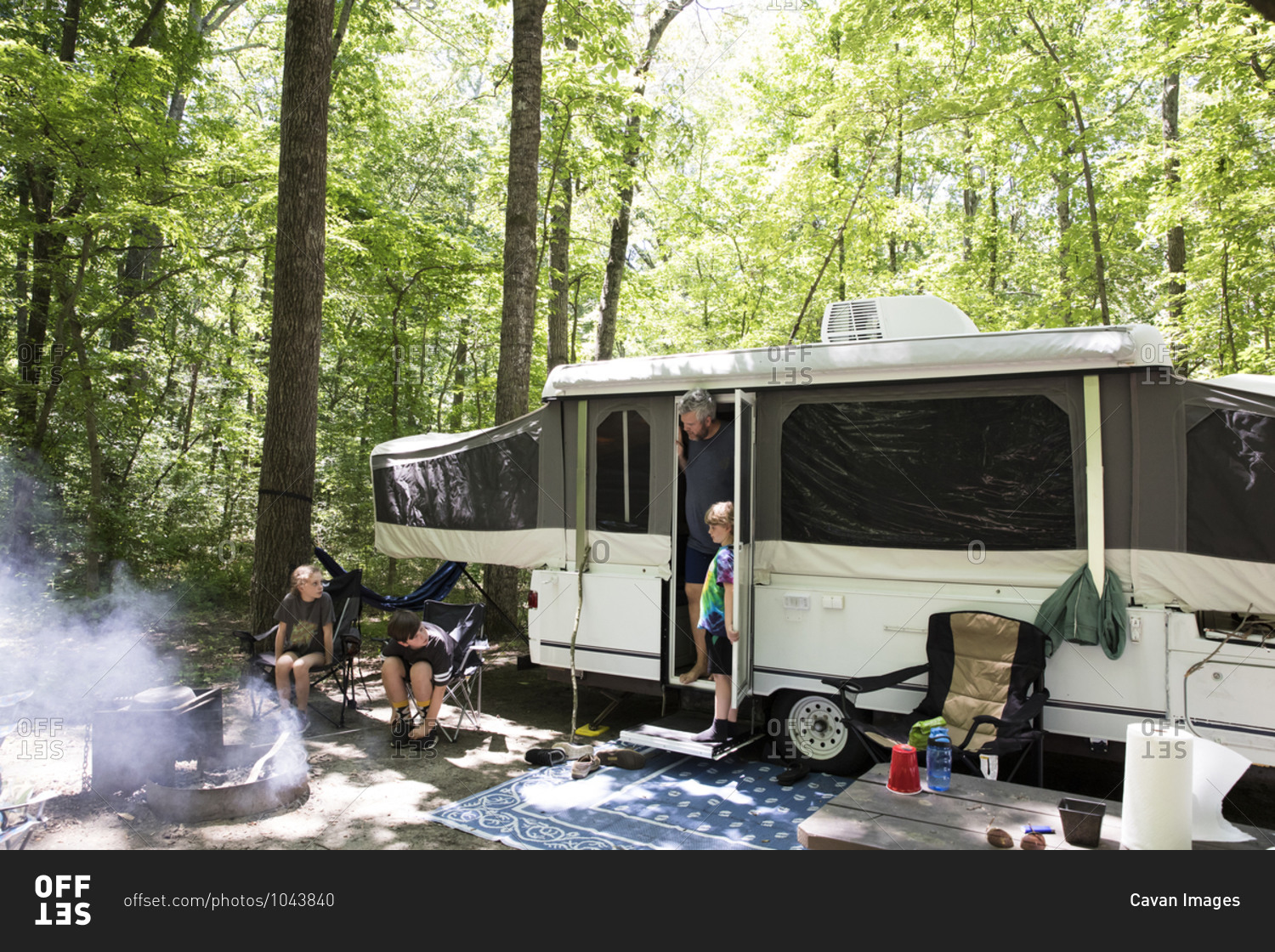 Wide View of Pop Up Camper at Campsite on Family Camping Trip