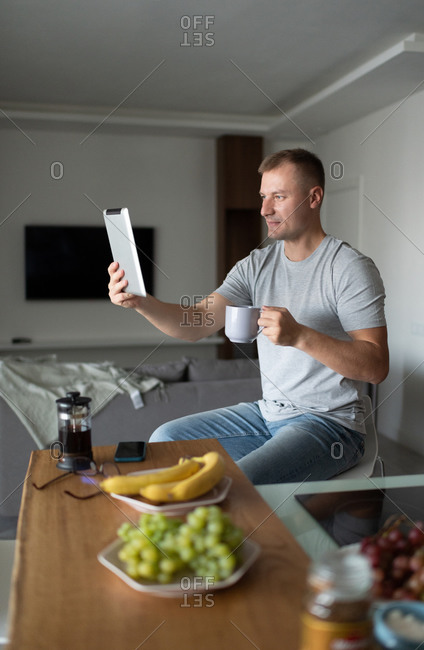 Man speaking with online friend in morning