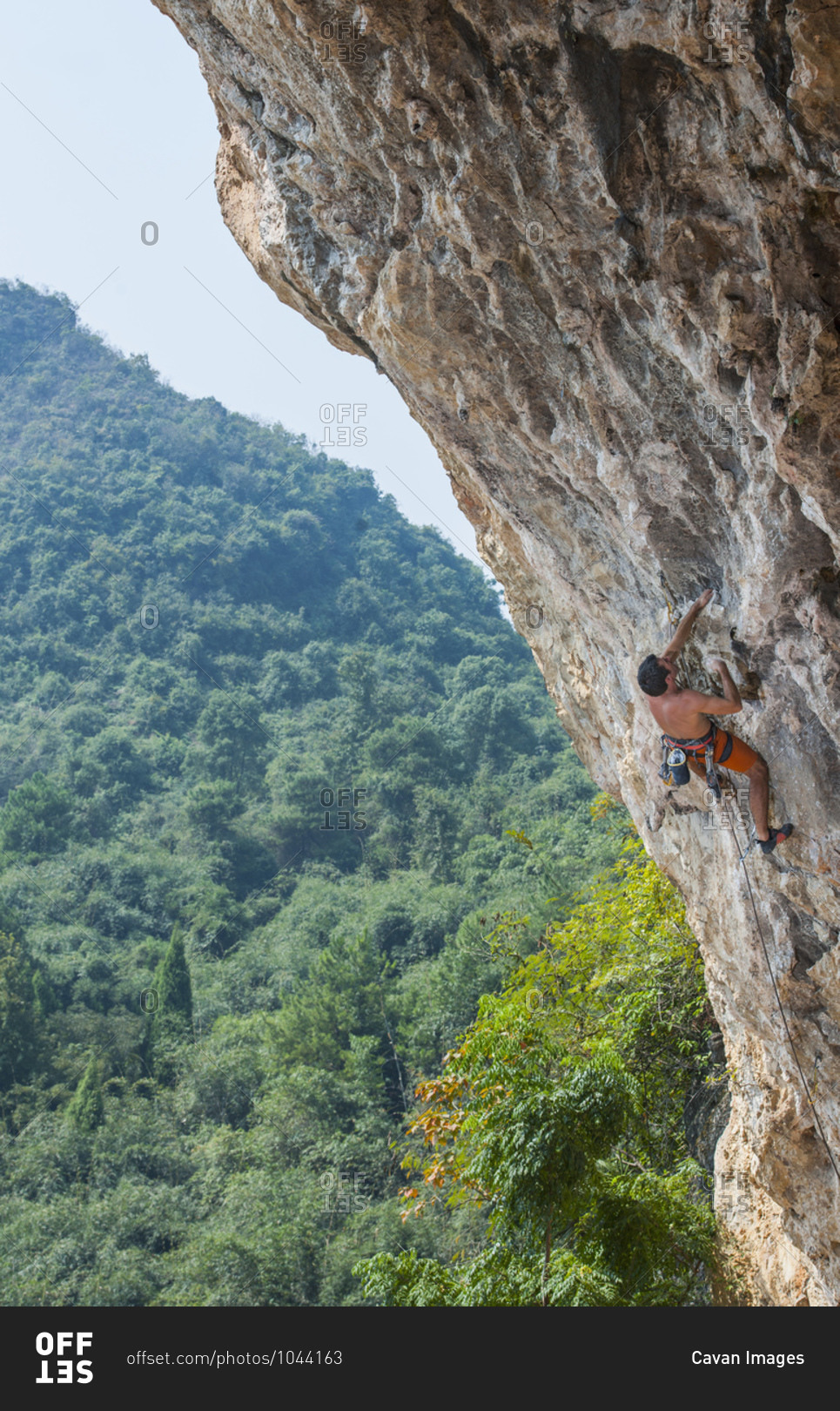 Man climbing at Odin\'s Den in Yangshuo, a climbing Mekka in China
