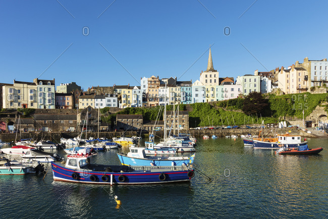 View of the town center and fishing boats in the harbor, Tenby, Pembrokeshire, Wales, United Kingdom, Europe