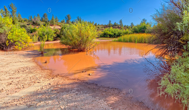 Toxic pond formed from runoff of mine tailings at an abandoned copper mine in the Prescott National Forest near Perkinsville, Arizona, United States of America, North America