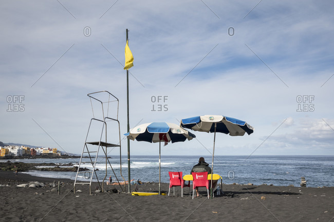 January 27, 2020: lifesaver on playa jardin beach, Puerto de la Cruz, tenerife, canary islands, Spain
