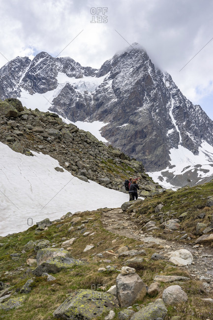 Europe, austria, tyrol, otztal alps, pitztal, plangeross, hikers against the backdrop of the watzespitze