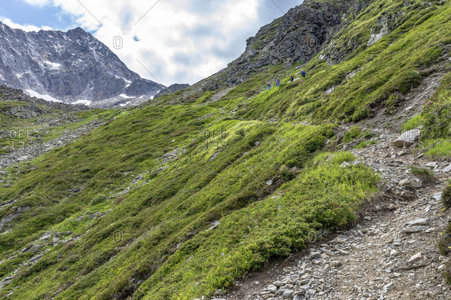 Europe, austria, tyrol, otztal alps, pitztal, plangeross, hikers on the ascent path to karlesegg in the kaunergrat