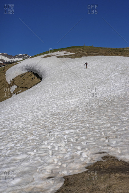 Europe, austria, tyrol, otztal alps, otztal, hikers climb an old snow field up to the hohe mut