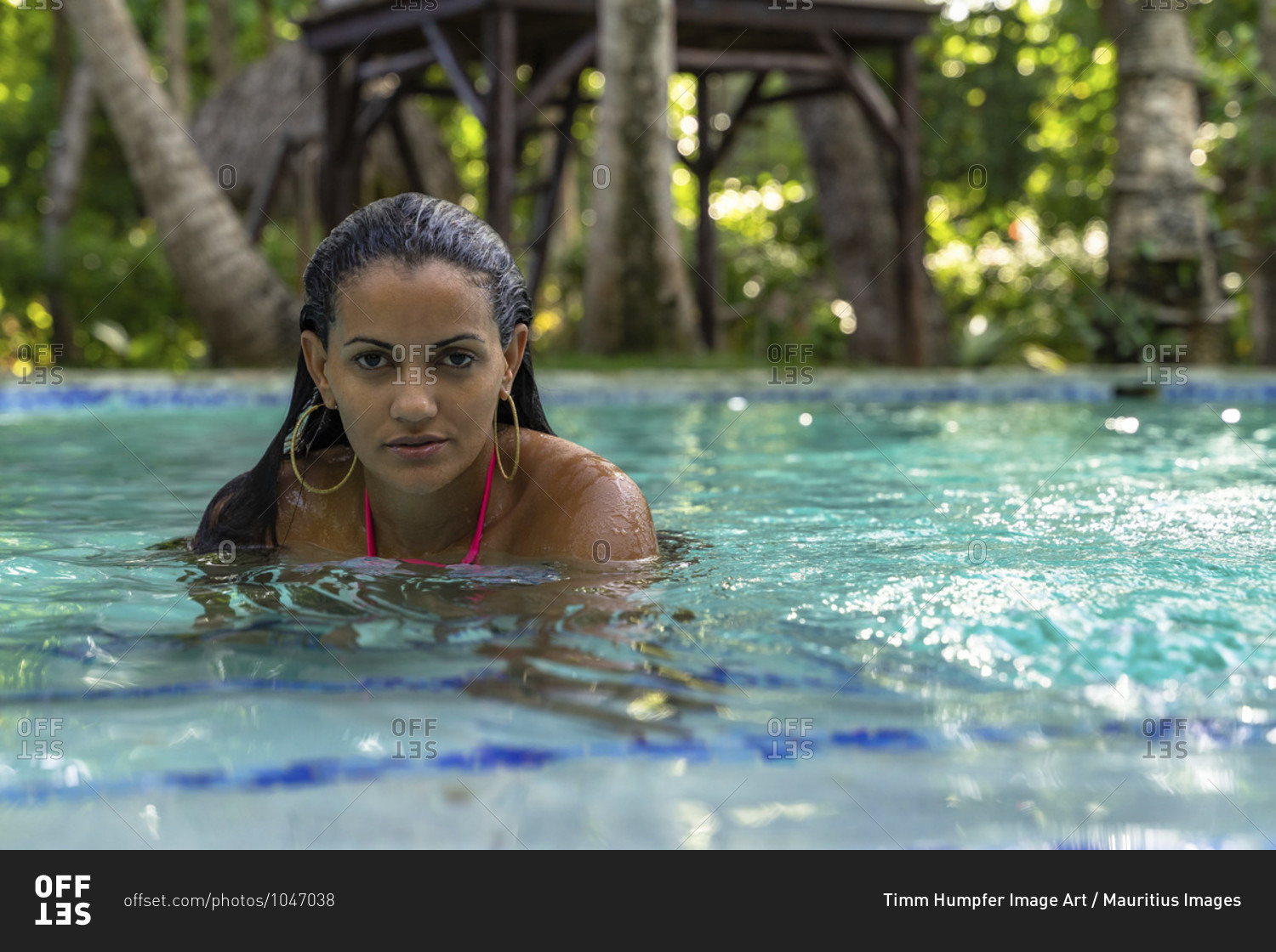 America, caribbean, greater antilles, dominican republic, cabarete, woman in the pool of the natura cabana boutique hotel & spa