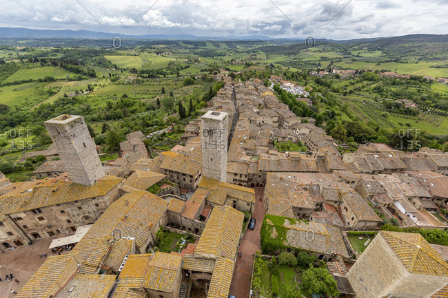 View of San Gimignano from the tallest tower, Torre Grossa. San Gimignano is a small Italian town in Tuscany with a medieval town center.