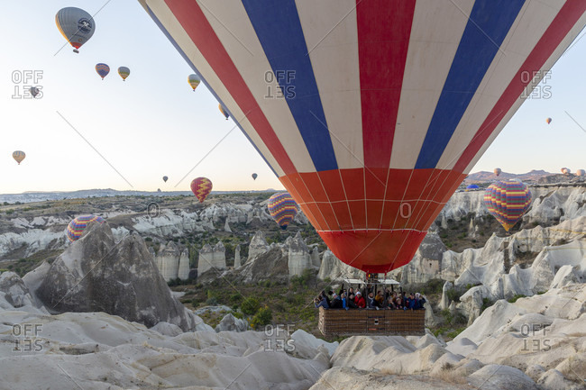 September 29, 2019: Hot air balloon in the morning in the eroded landscape near Goreme, Cappadocia, Anatolia, Turkey