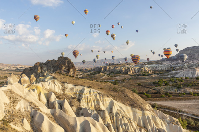 September 27, 2019: Hot air balloon in the morning in the eroded landscape near Goreme, Cappadocia, Anatolia, Turkey