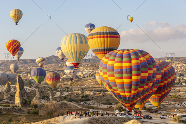 September 27, 2019: Hot air balloon in the morning in the eroded landscape near Goreme, Cappadocia, Anatolia, Turkey