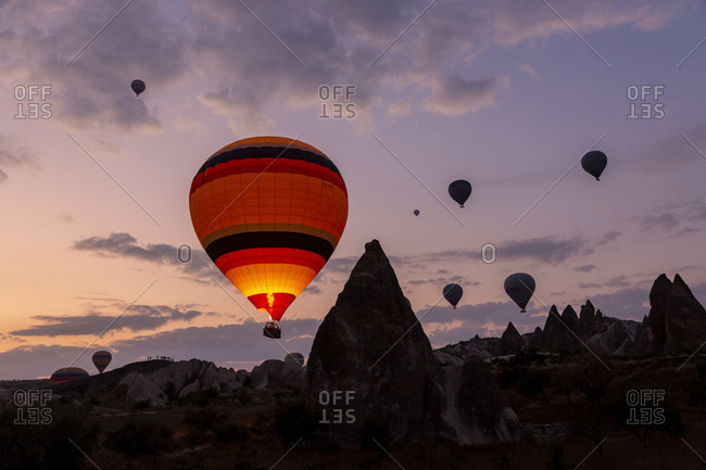 Hot air balloon in the morning in the eroded landscape near Goreme, Cappadocia, Anatolia, Turkey