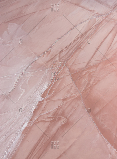 Aerial view of abstract minimal pink salt lake textures and pastel colors on Lake Lefroy, Western Australia