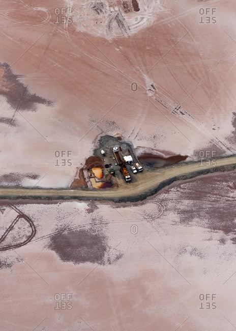 Aerial view of industrial mining operations and machinery with salt lake textures on Lake Lefroy, Western Australia