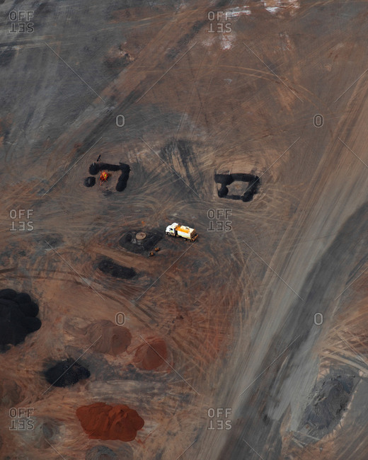 Aerial view of industrial mining operations and machinery with salt lake textures on Lake Lefroy, Western Australia