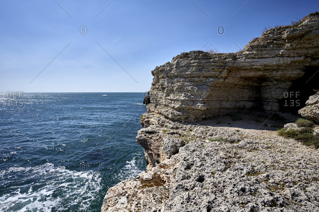 View of the Black sea coast against a clear blue sky. Yailata National Nature and Archaeological Reserve is located 1.5 km southern from the village.