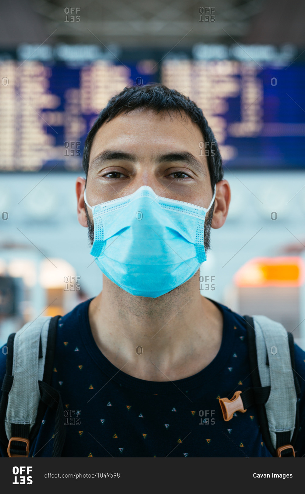 Portrait of a young man wearing a face mask on the airport
