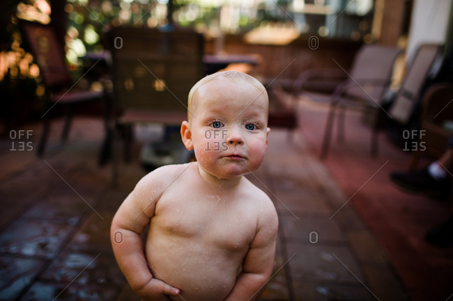 Close up of one year old boy soaking wet in san diego