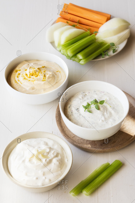 Variation of sour cream with vegetable stick kept on table