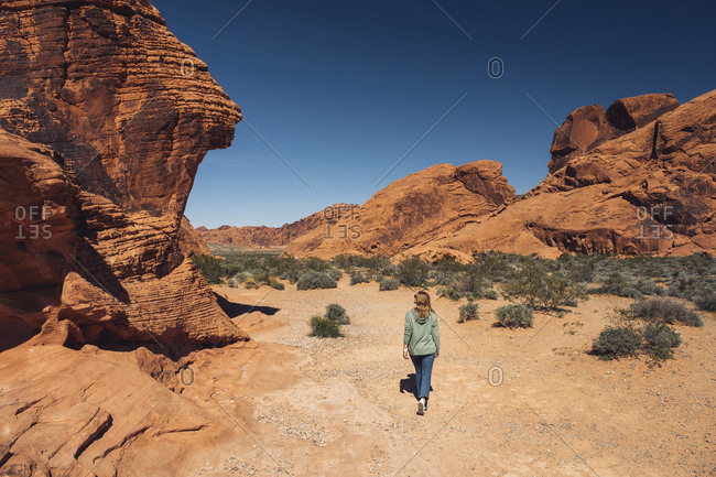 Woman exploring Valley of Fire State Park in summer- Nevada- USA