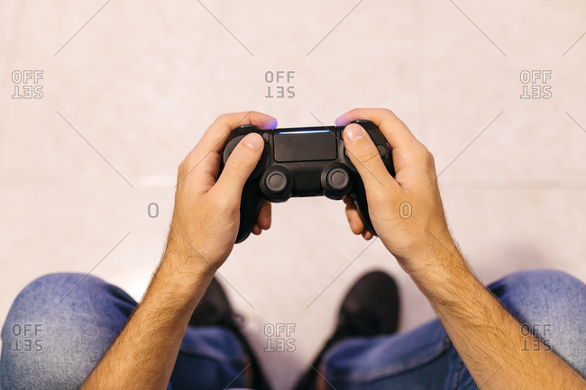 Gamer using vr glasses and controller to play video games. Man with virtual  reality goggles holding joystick in front of computer, playing online game.  Player having fun with games Stock Photo 