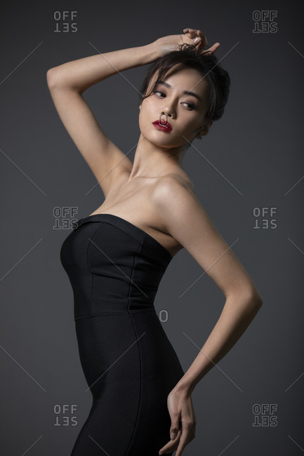 Beautiful young Chinese woman in black dress