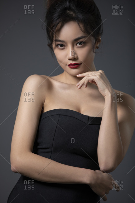 beautiful woman black dress stock photos - OFFSET