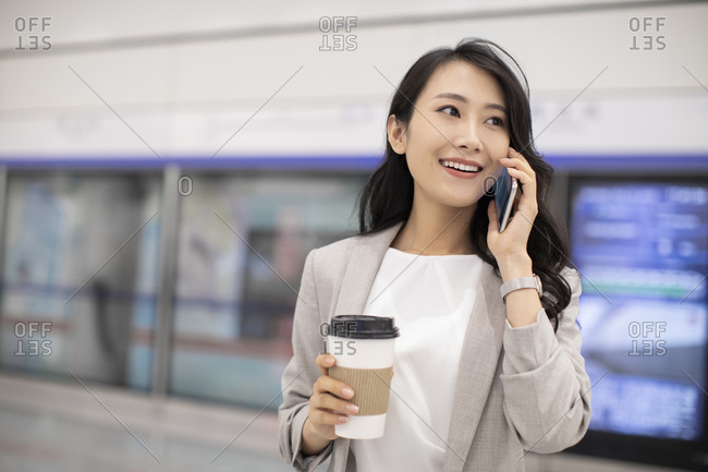 Young Chinese businesswoman in subway station