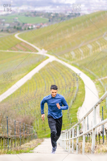 Man, 21 years old, jogging on kappelberg, remstal, Baden-Wurttemberg, Germany