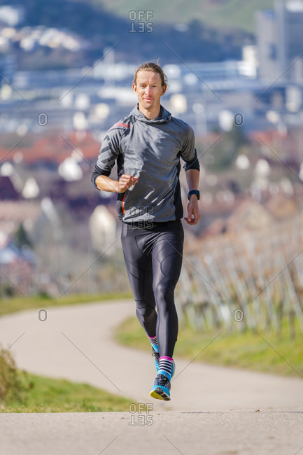 Man, 30 years old, jogging on kappelberg, remstal, Baden-Wurttemberg, Germany