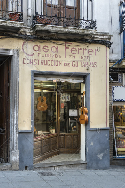 February 15, 2020: granada (spain), cuesta de gomerez, street of the guitar makers, guitar shop