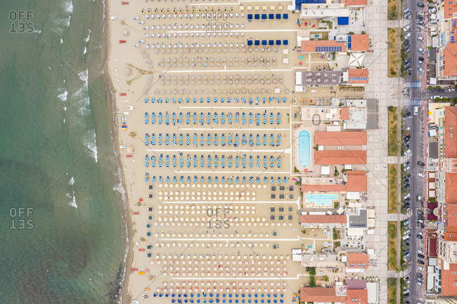 Aerial view of huge beach with many umbrella's in Viareggio, Italy.