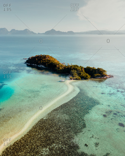 Aerial view of remote beach and coral reef, El Nido, the Philippines.